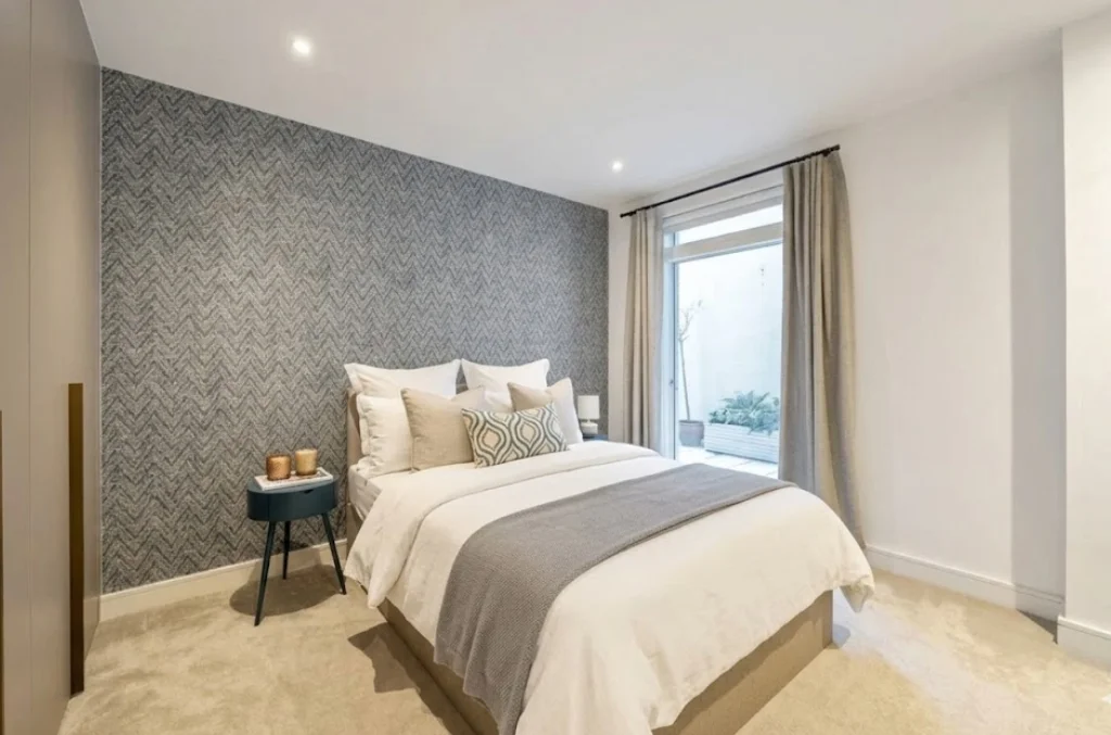 Double bedroom with feature wallpaper at The Avenue, Queen's Park NW6